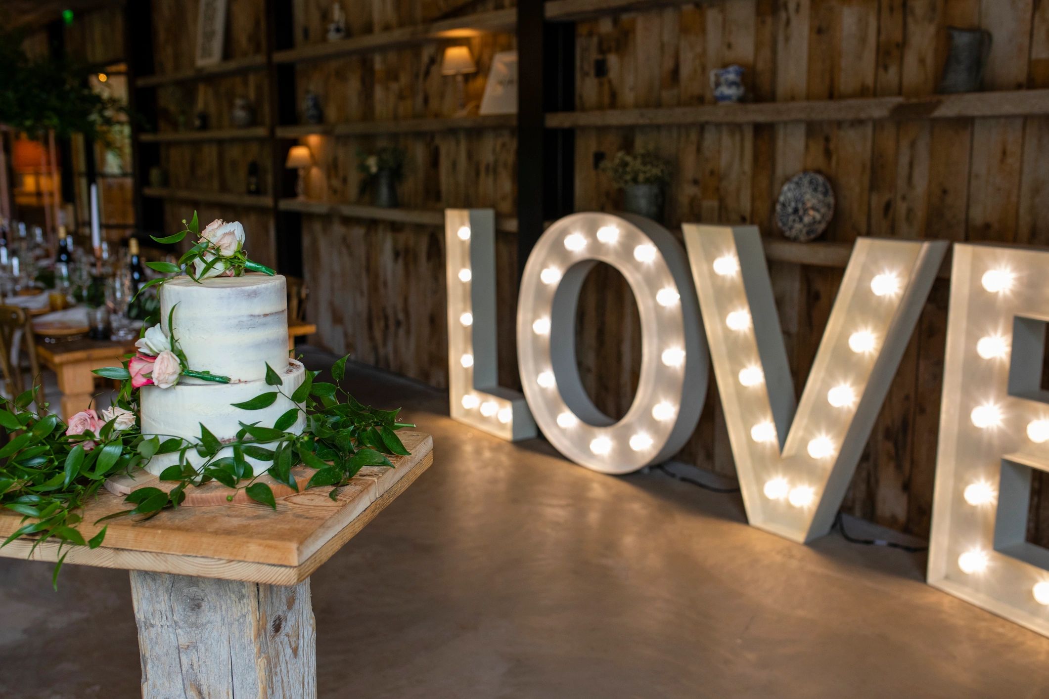 Wedding cake display on a decorated dessert table