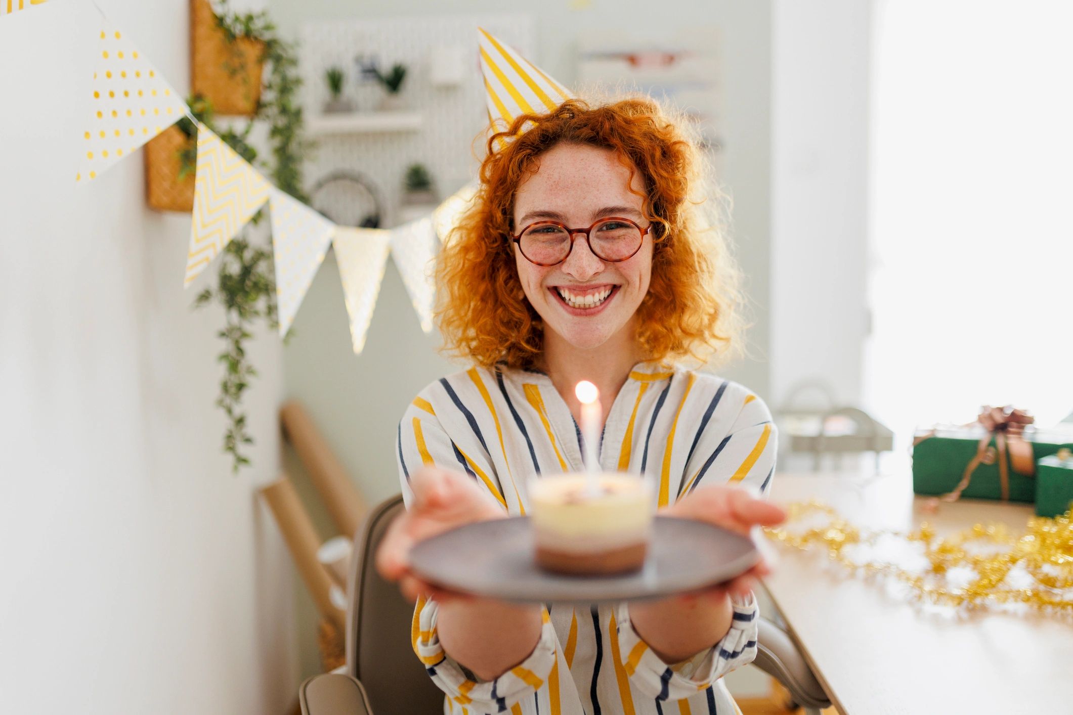 Smiling customer celebrating with a cake