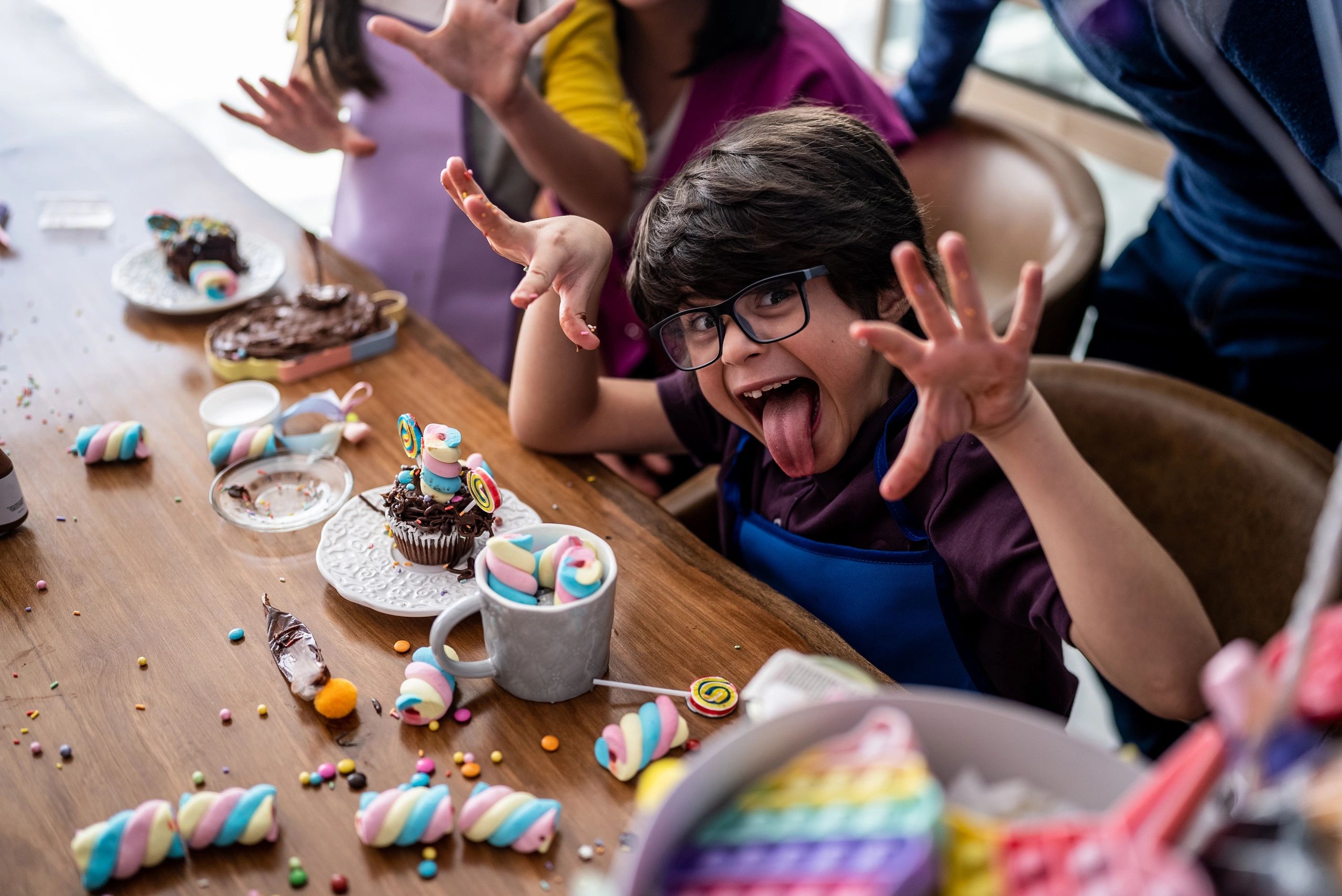 Child with sweets at home