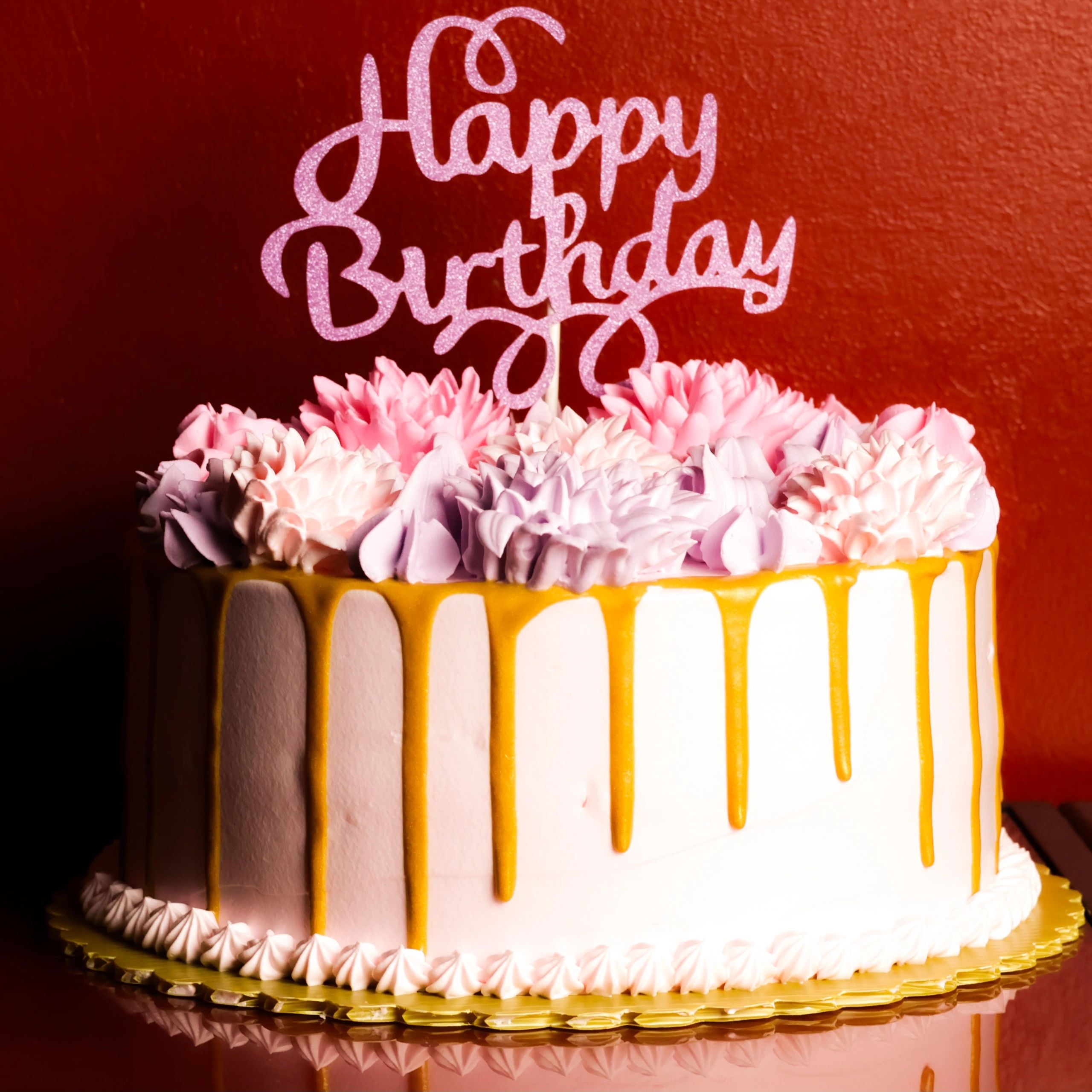 Birthday cake with purple and pink floral frosting