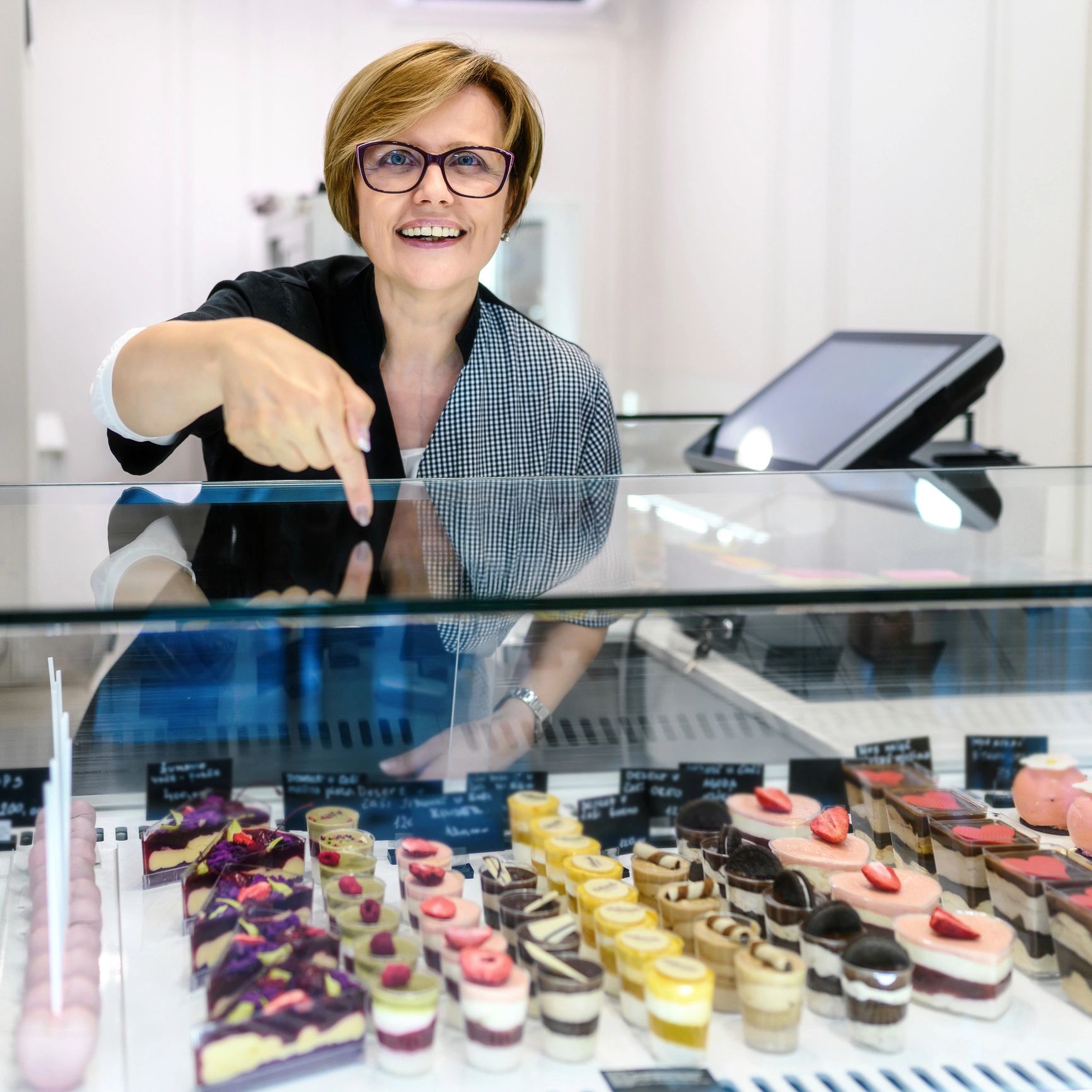 Portrait of a confectioner in a pastry shop