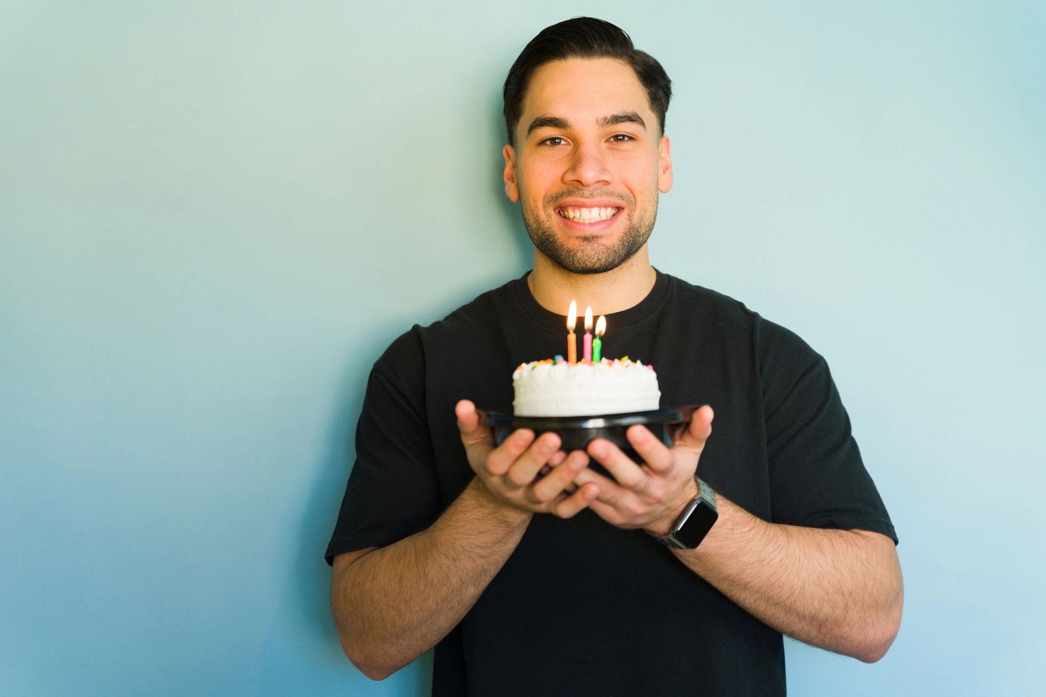 Happy customer holding a birthday cake