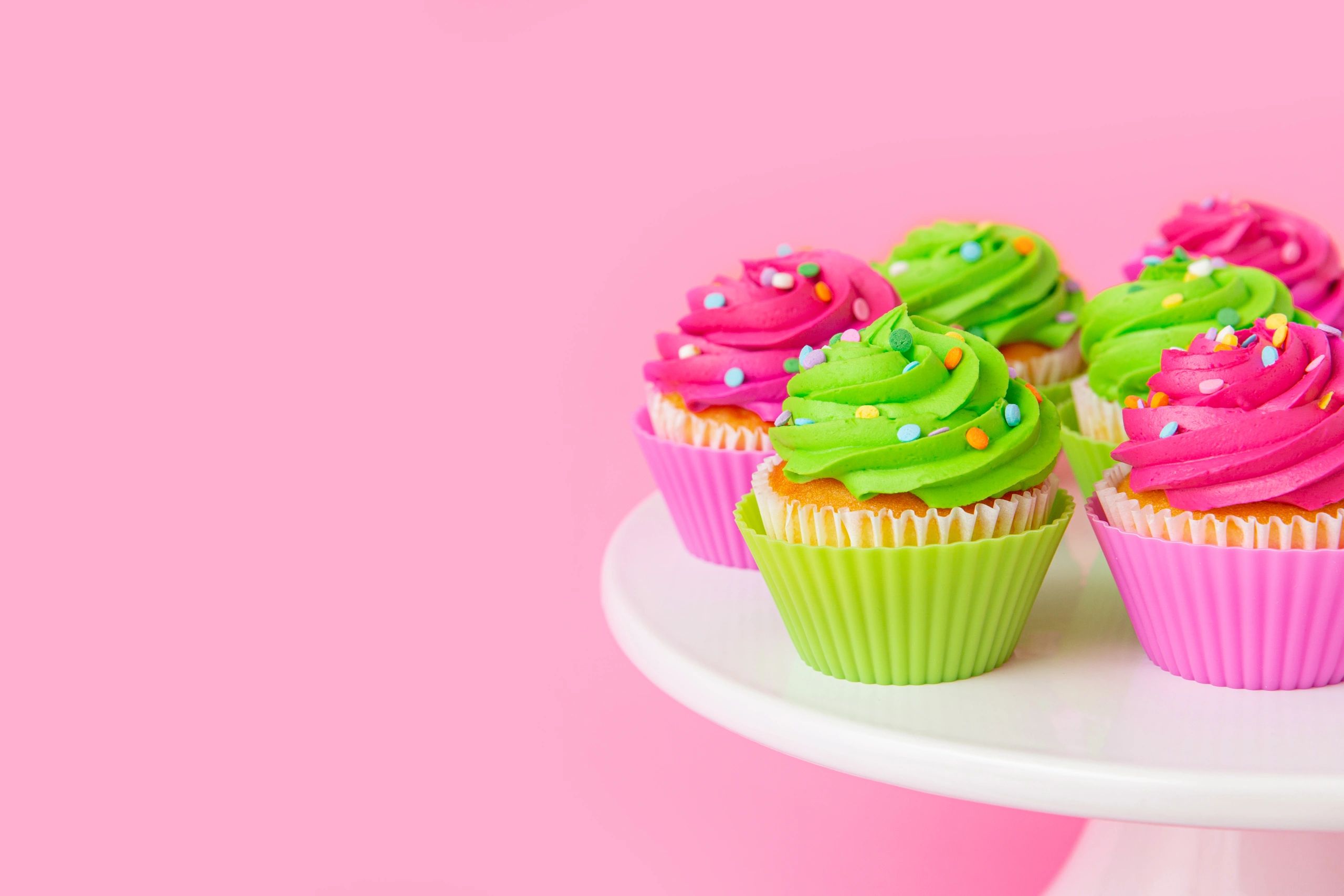 Colorful cupcakes with swirled frosting and sprinkles