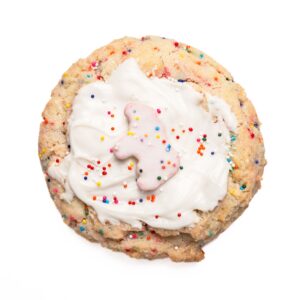 Rainbow layer cake product photo with vibrant multicolor frosting